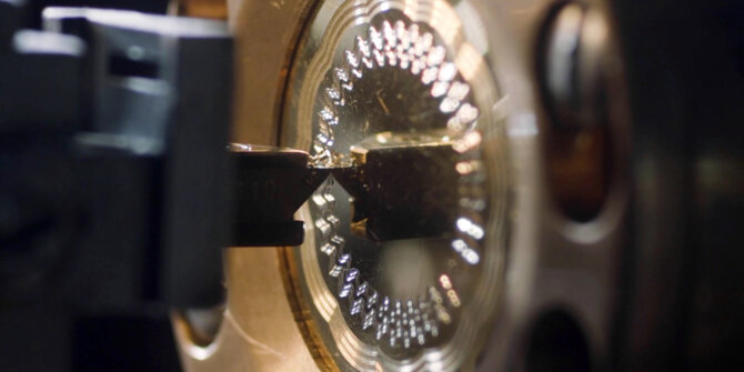 Faceted crystal glass part held in a jig, backlit macro – DS Savoir-faire in Motion