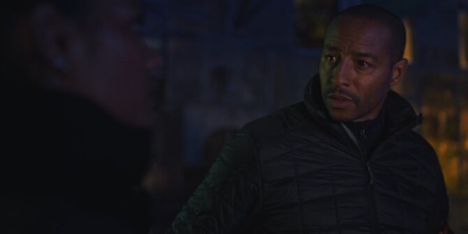 Detective in a padded jacket turning his head at night – OPJ Season 5 Double Lady