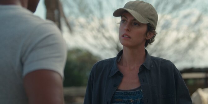 Young woman in a cap looking up at a man outdoors – OPJ Season 6 Forbidden Fruit